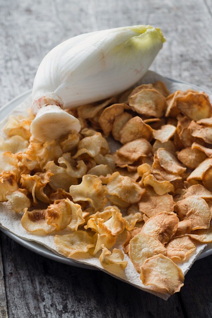 Chicory chips as a snack on a plate