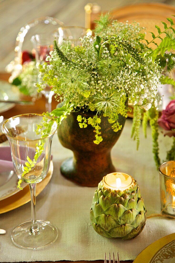 Artichoke-shaped tealight holder on festively set table