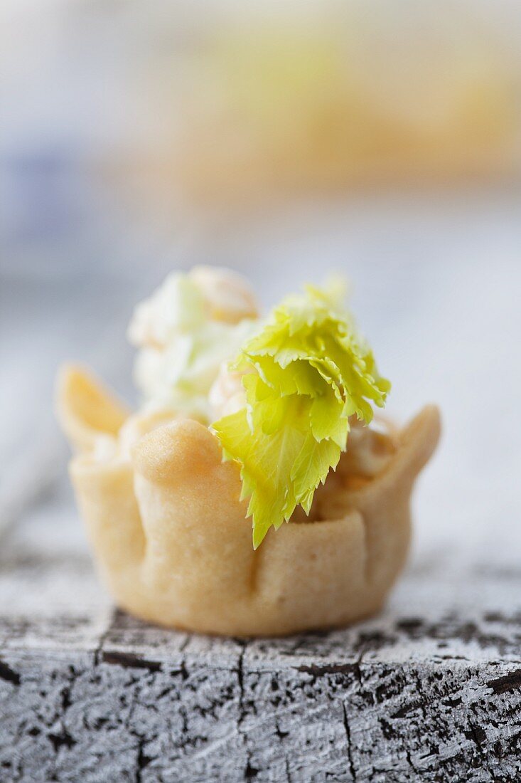 Chicken salad with celery and sweetcorn served in pastry bowls