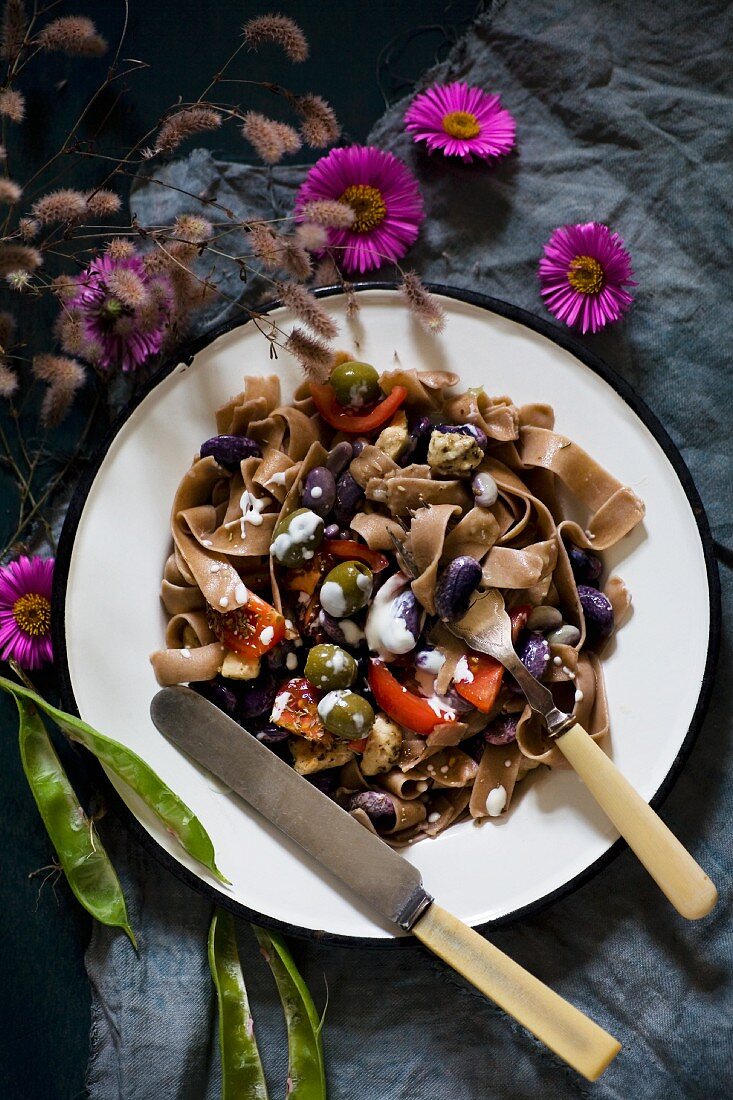 Rye pasta with beans and olives