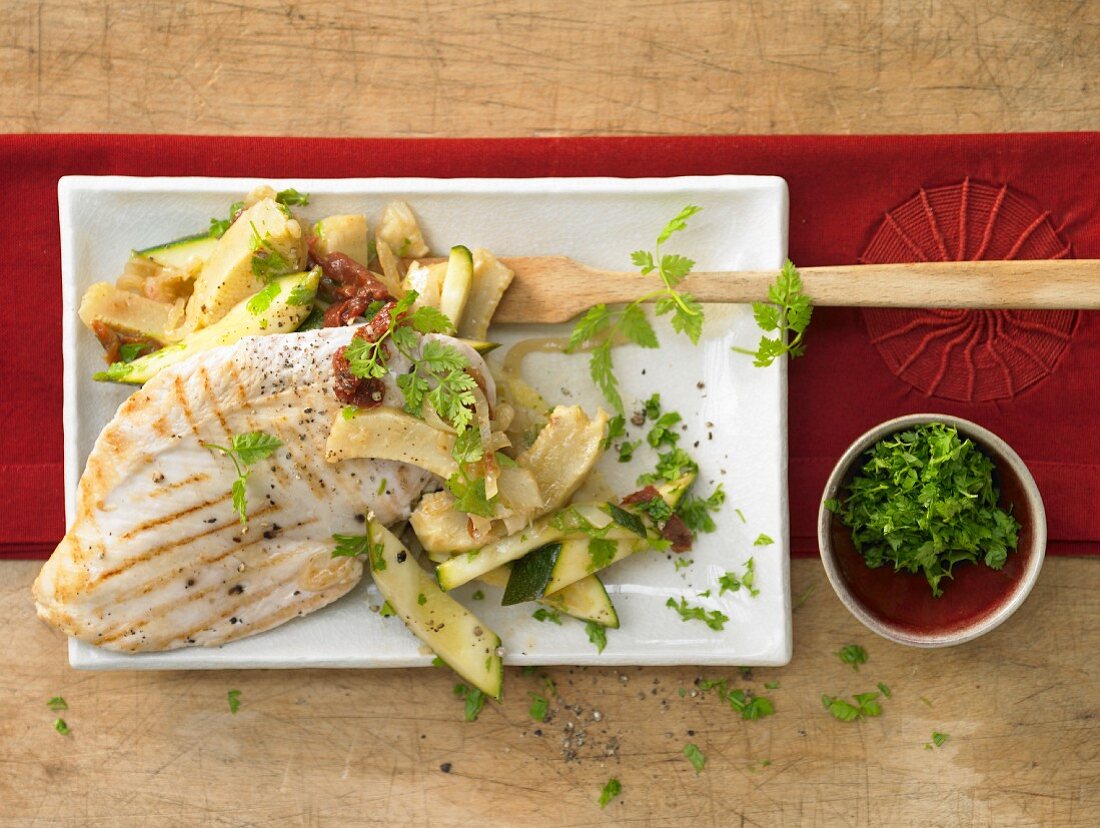 Grilled chicken breast with artichoke and courgette