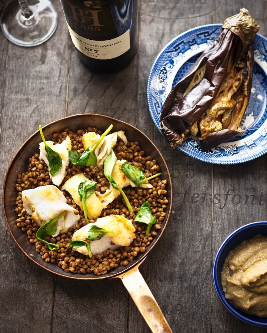 Fried monkfish on a bed of lentils with aubergine