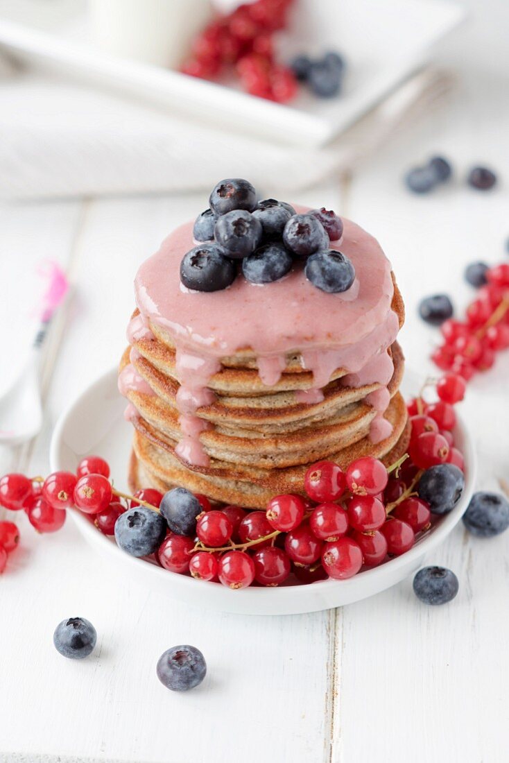 Gluten-free buckwheat pancakes with vanilla sauce and berries