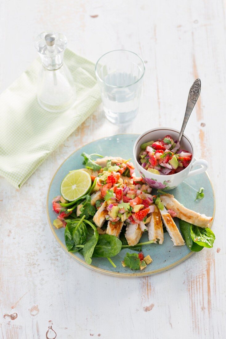 Grilled chicken fillets with avocado and strawberry salsa
