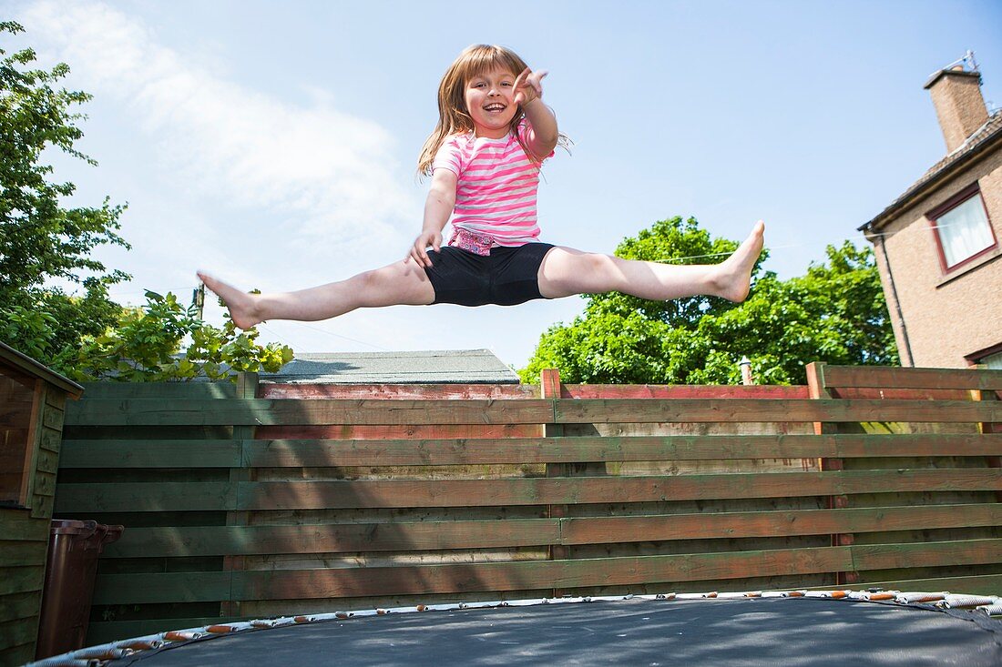 Young girl on trampoline