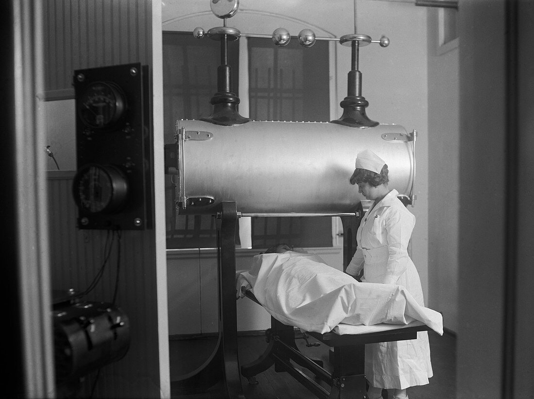 Hospital patient being X-rayed,1920s