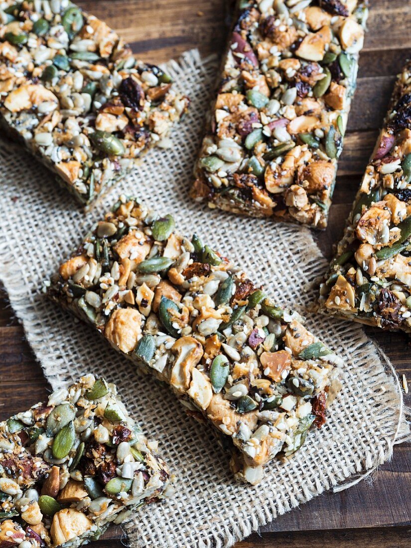 Homemade gluten-free paleo nut bars on a wooden table