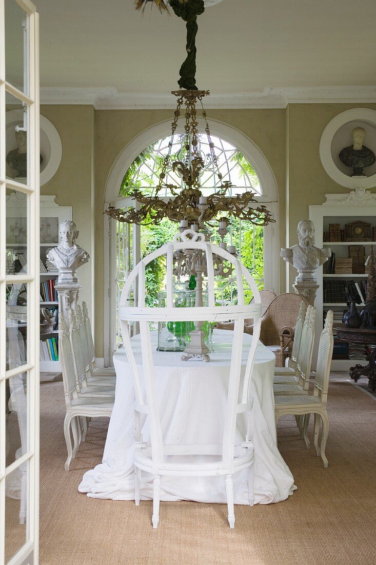 Throne and opulent chandelier in grand dining room