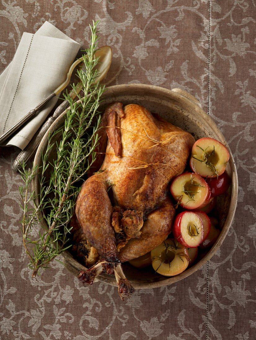 A stuffed turkey with plums and rosemary