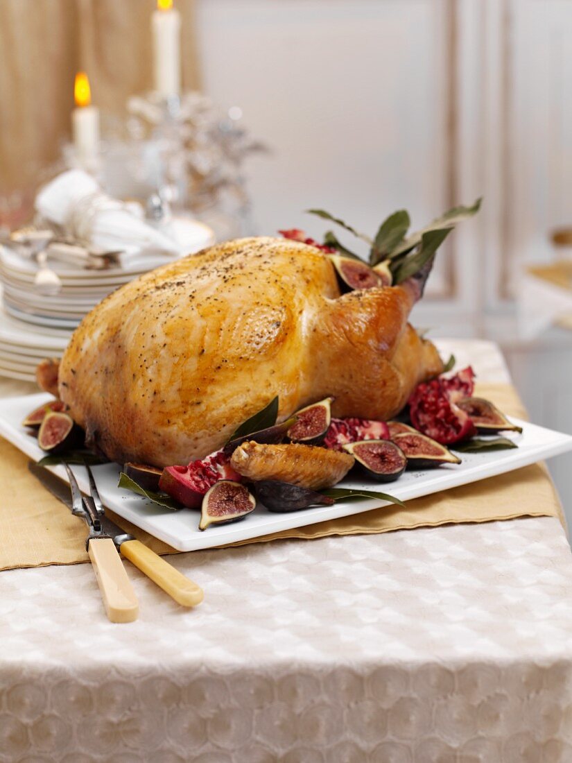 A whole roast turkey with figs and pomegranate for Christmas