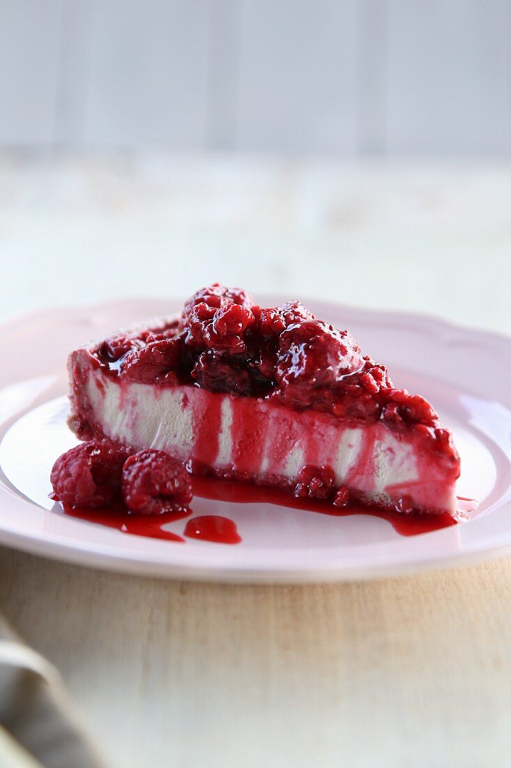 A slice of vegan raspberry and vanilla cheesecake