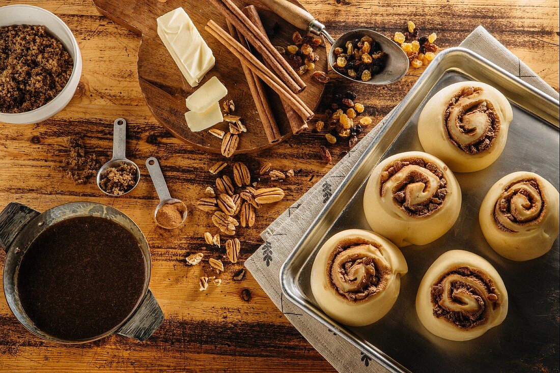 Unbaked cinnamon buns and ingredients