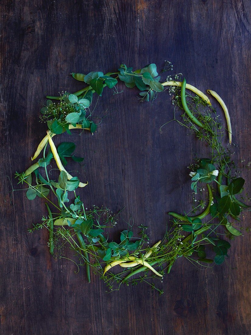 A wreath of beans, sugar snap peas, and pea tendrils