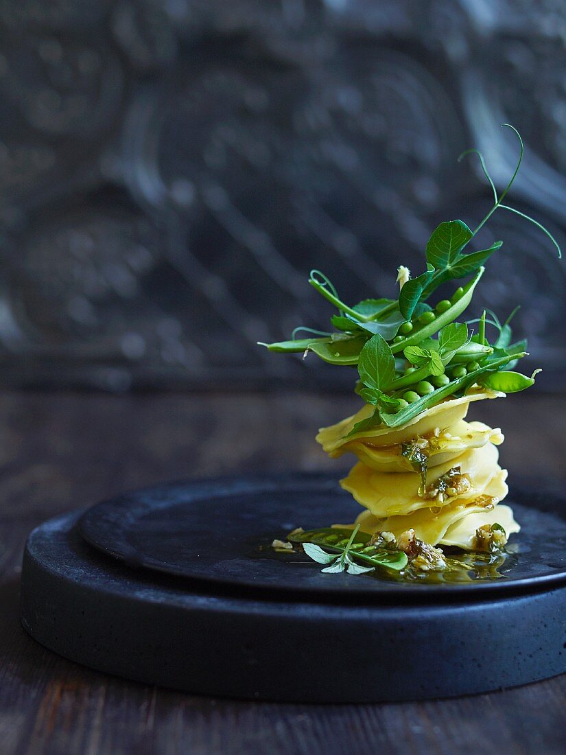 Ravioli with nut and mint pesto, and sugar snap peas