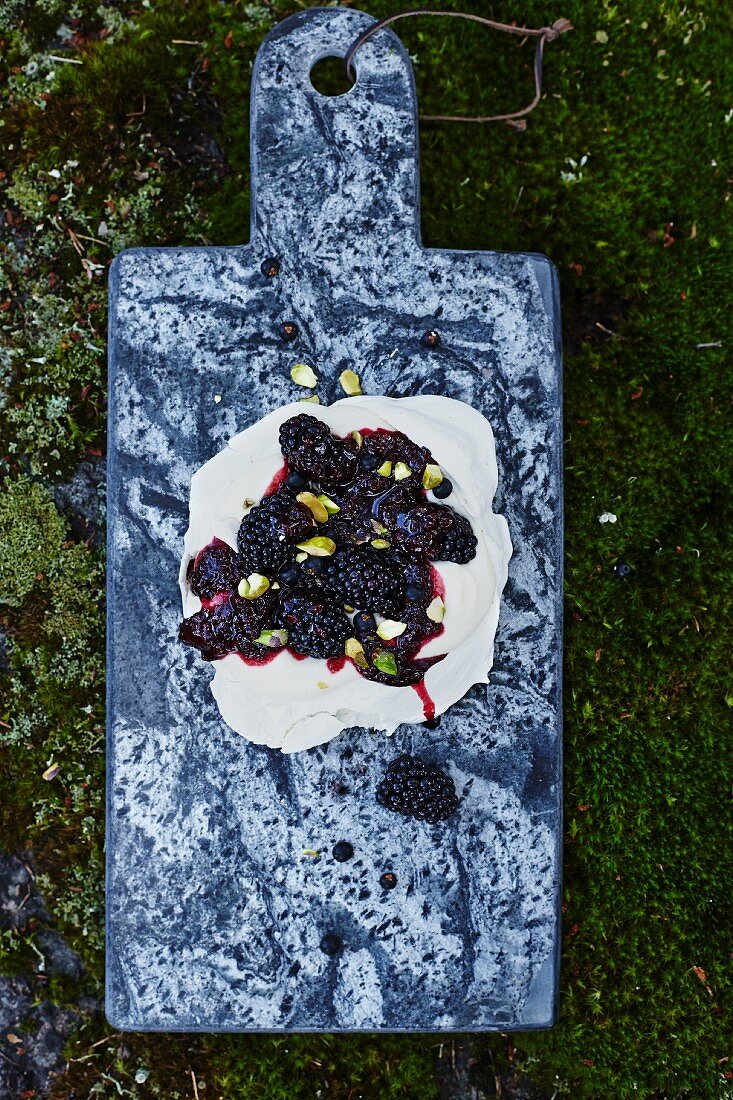 Pavlova with blackberries and pistachios