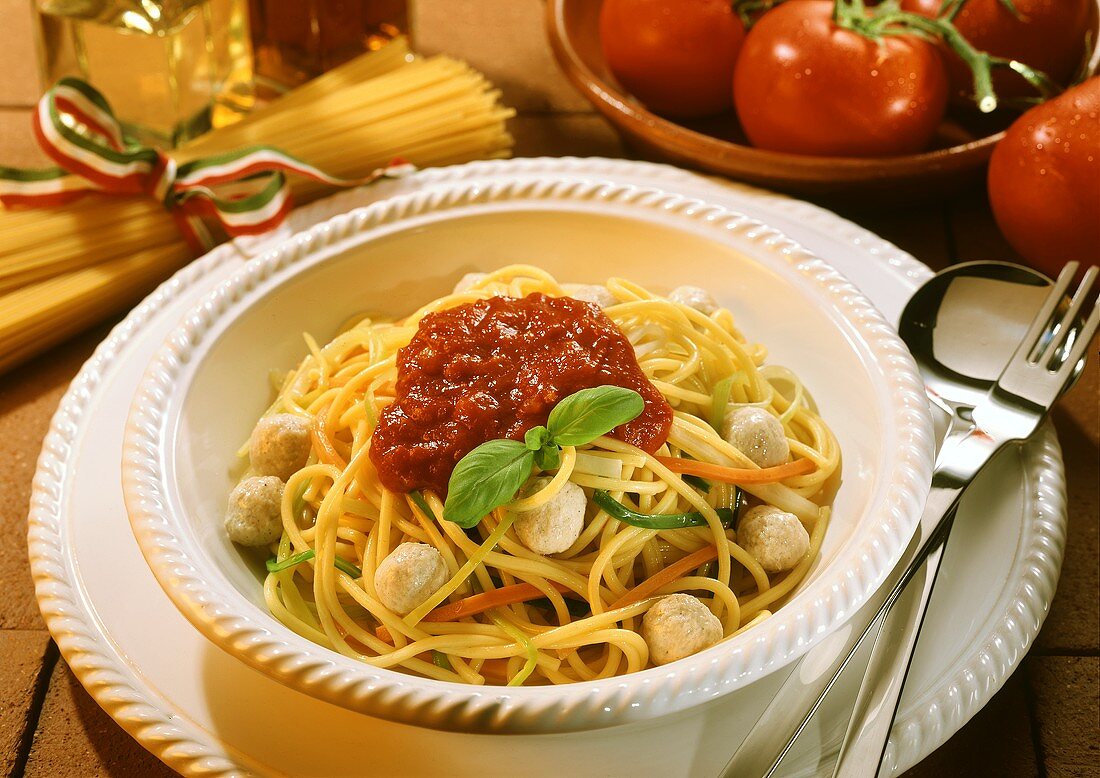 Spaghetti with tomato sauce, veal balls & vegetable strips