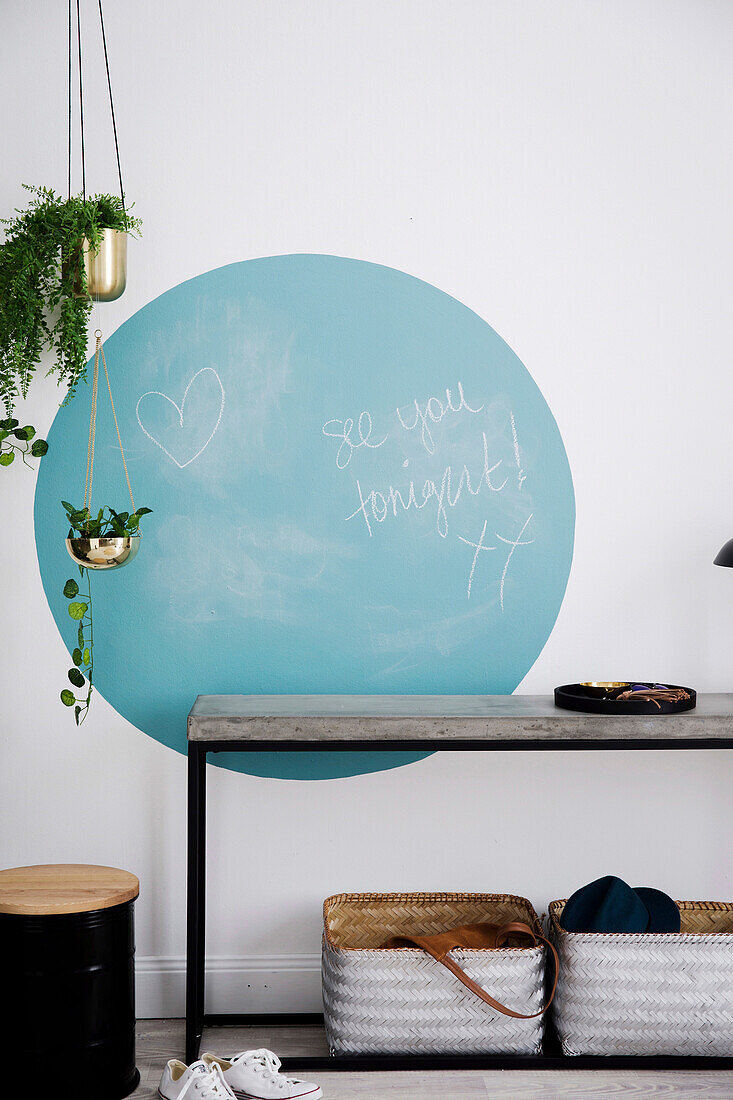 Blue circle with blackboard paint above the console table in the hallway