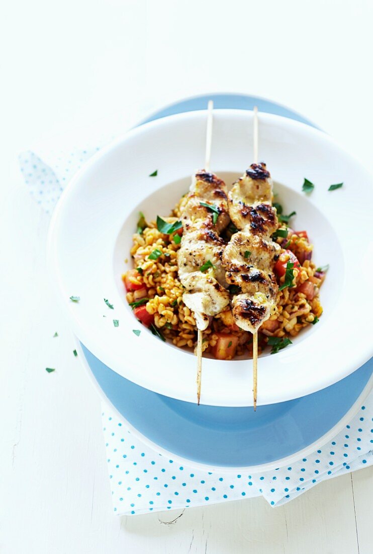 Tabouleh with grilled chicken skewers