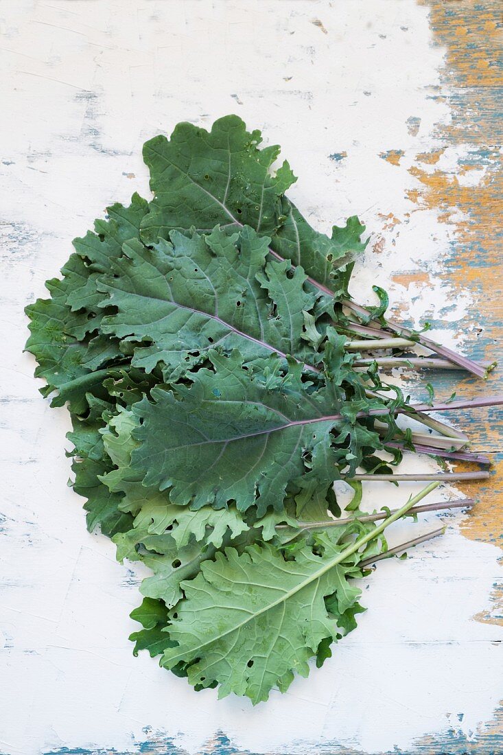 Fresh kale leaves on a wooden table