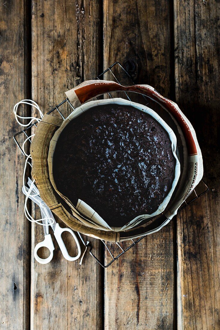 Spelt and amaretto fruit cake in a baking tin