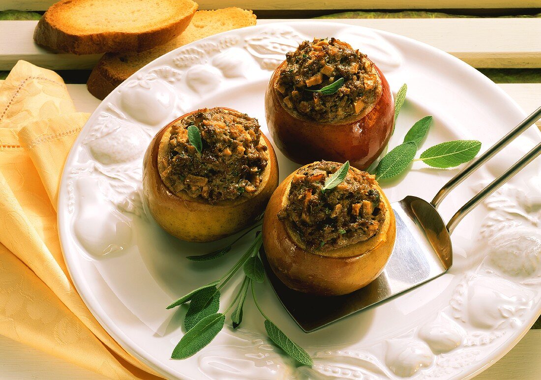 Three baked Apples with Liver and Herb Stuffing and fresh Sage