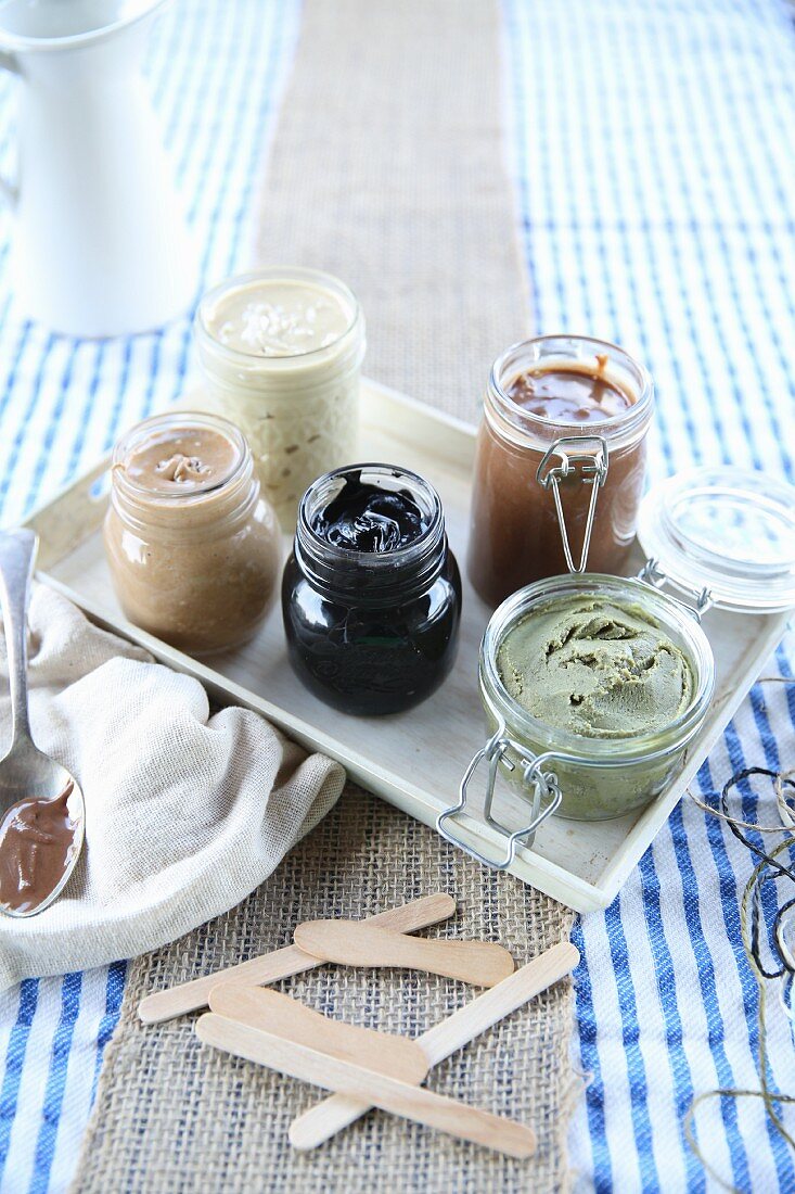 Various vegan nut butters in preserving jars