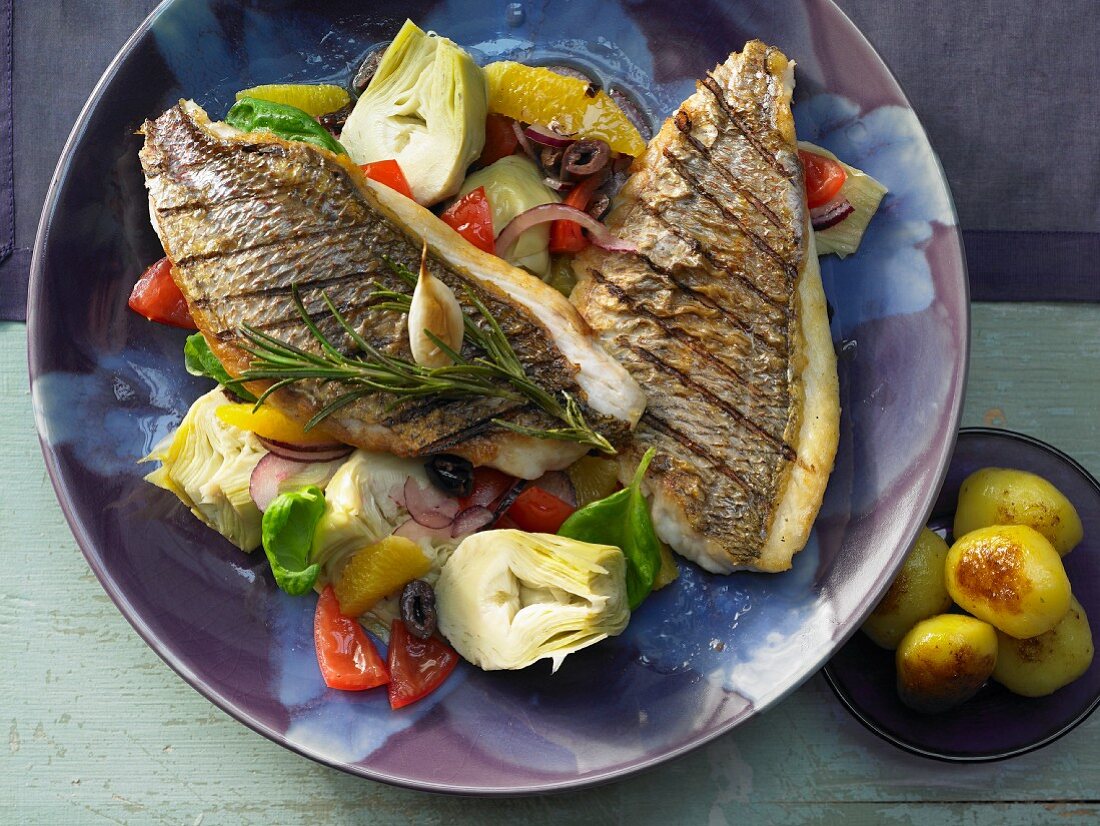 Gilt-head bream fillets with an artichoke salad