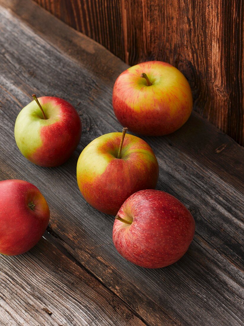 Fresh apples on a wooden table