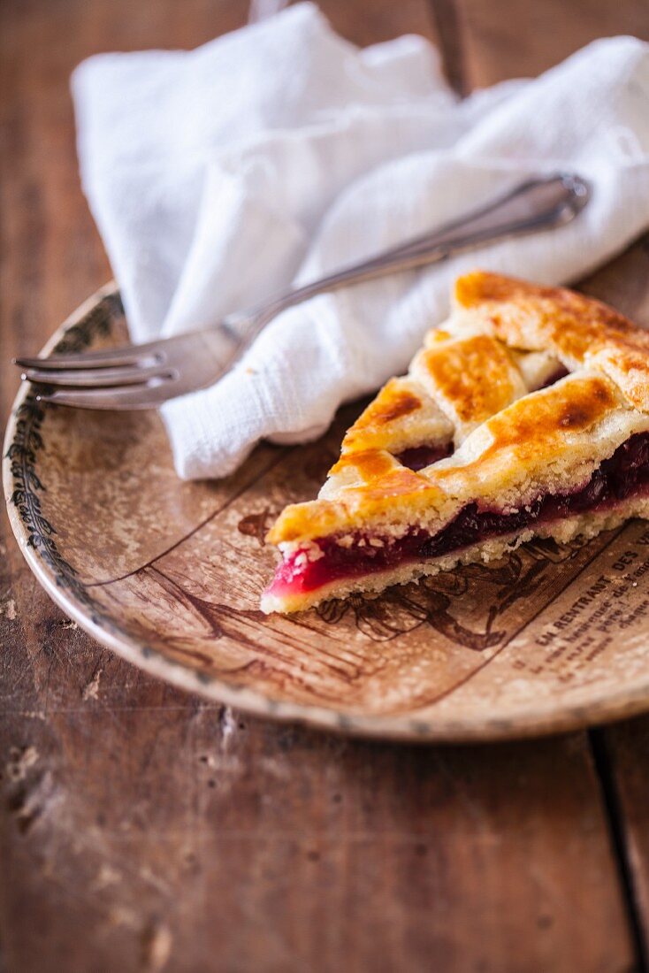 A slice of cherry lattice pie