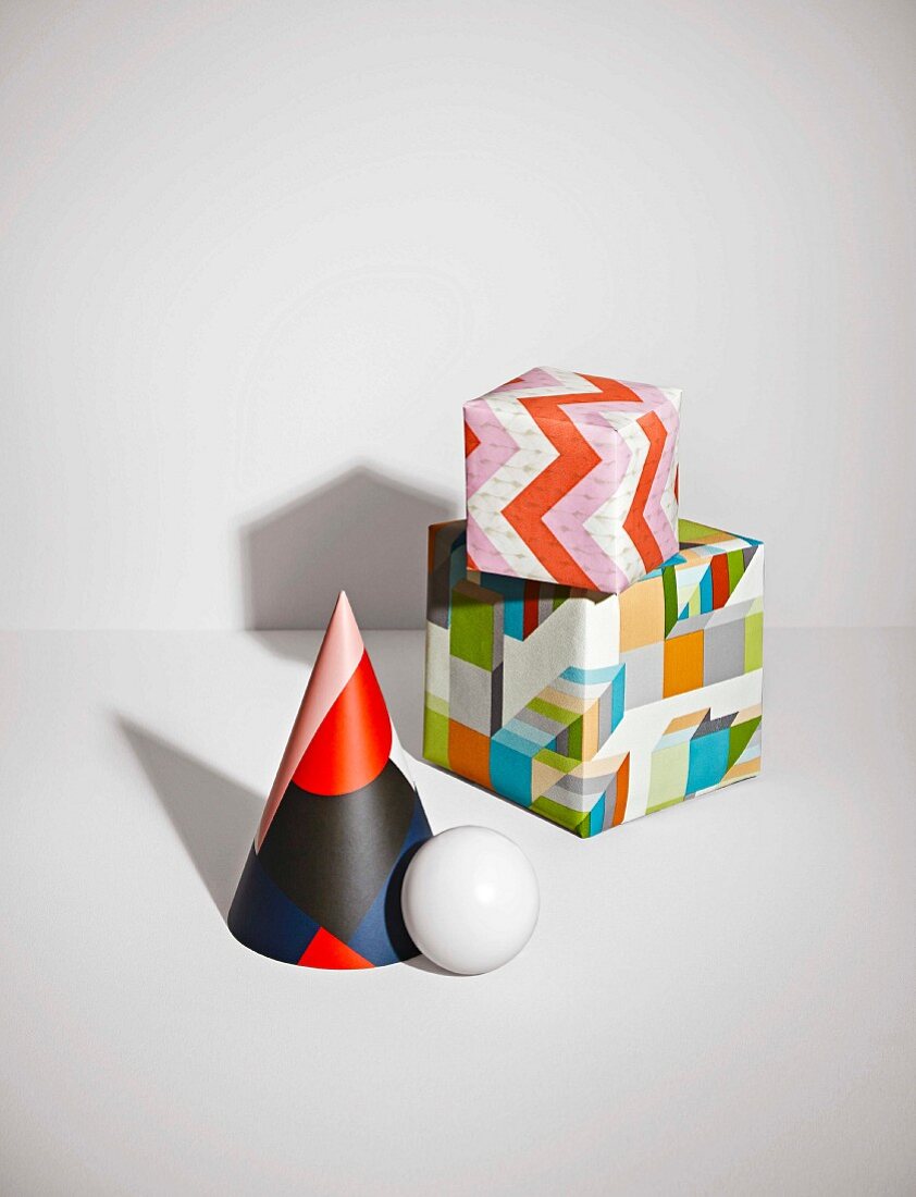 Wallpapers with graphic and geometric patterns in cube and cone shapes