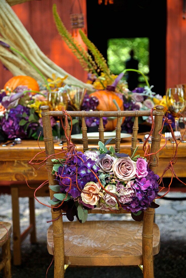 Country-style autumn dinner table in front of a barn (East Coast, New England, USA).
