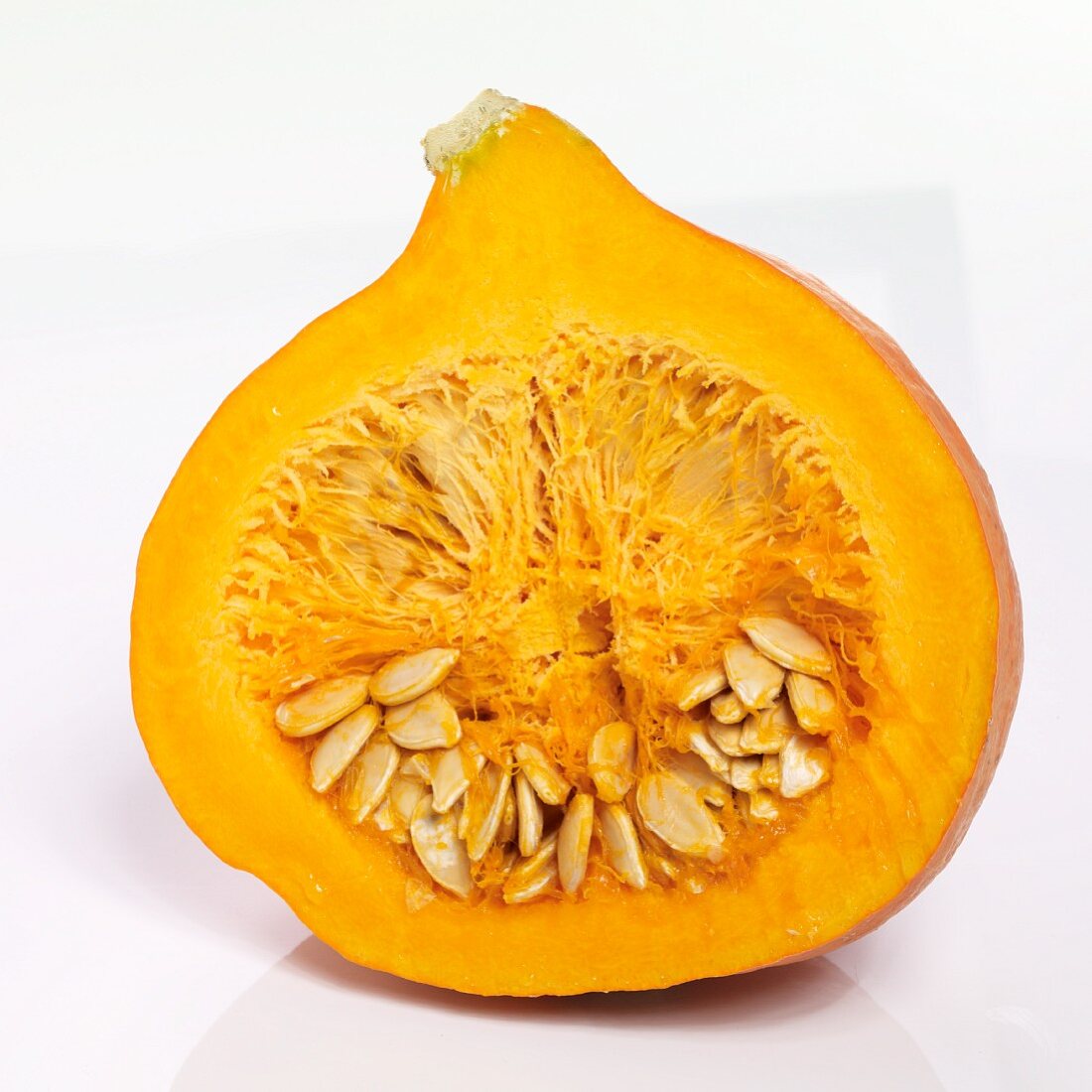 A Hokkaido pumpkin sliced in half