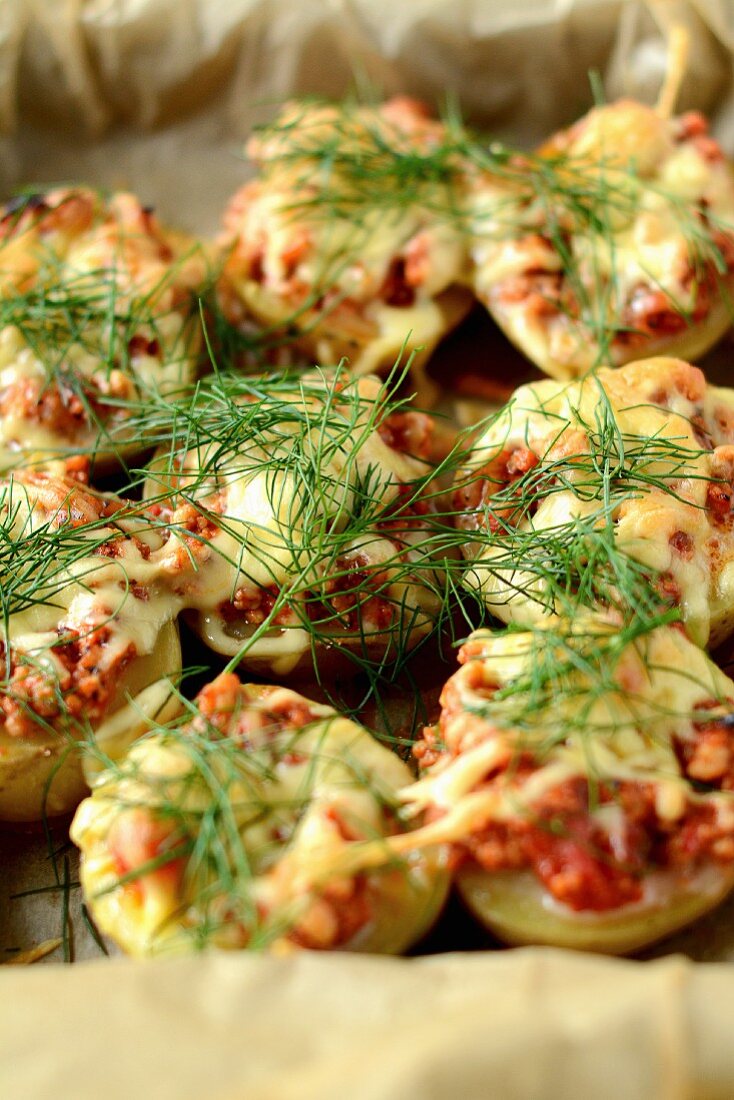Potatoes stuffed with minced beef, cheese and dill