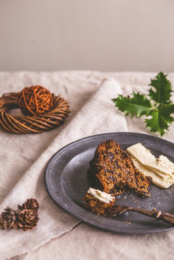 A slice of fruit cake served with Cheshire cheese