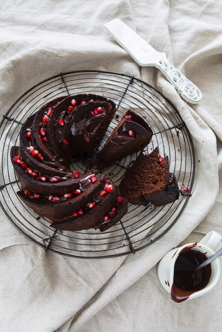 Slices of chocolate Bundt cake garnished with pomegranate seeds