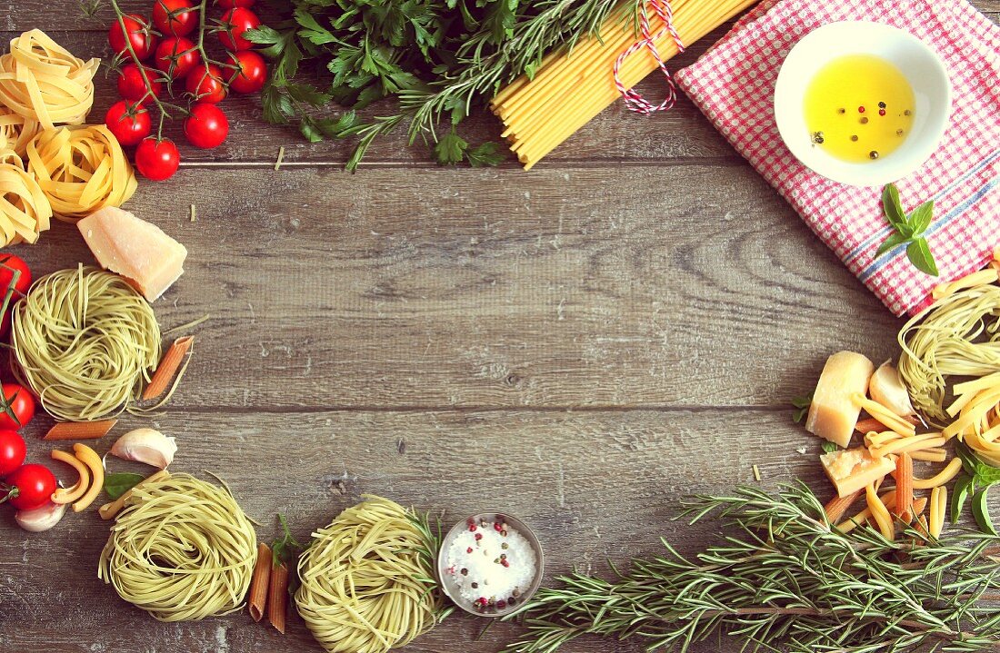 An arrangement of typical Italian food items on a wooden table