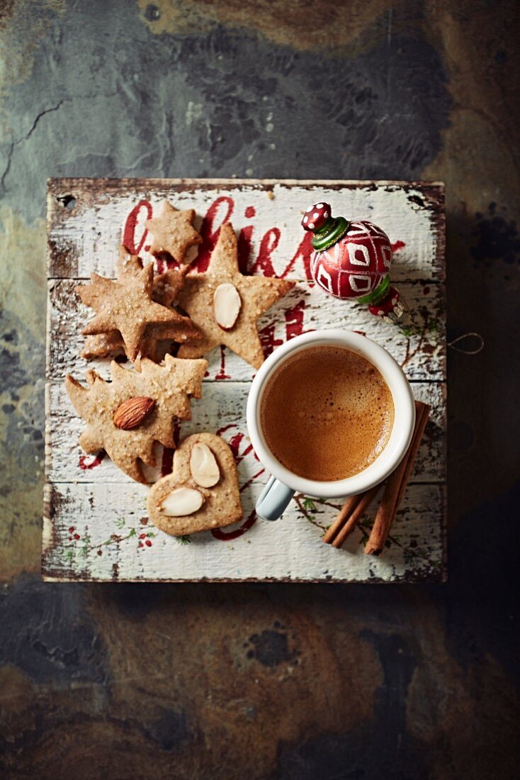 A cup of espresso with cinnamon Christmas biscuits