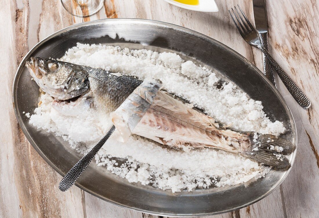 Baked sea bass covered with sea salt