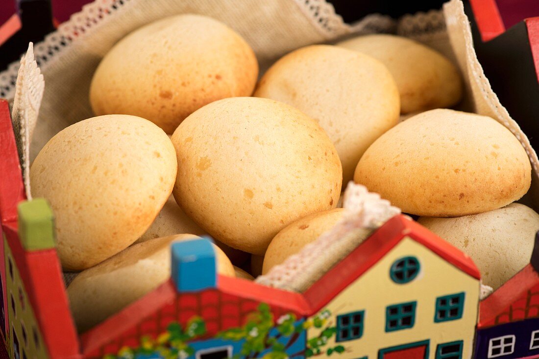 Sweet cheese bread rolls in a traditional bread basket