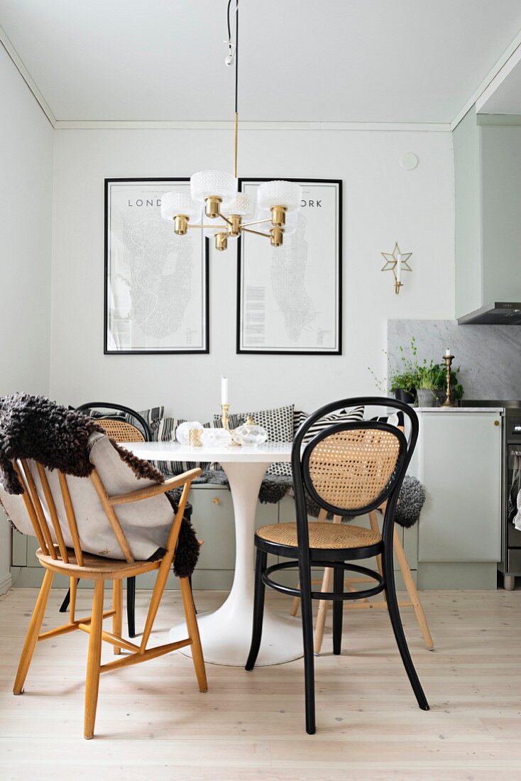 white tulip table with black chairs