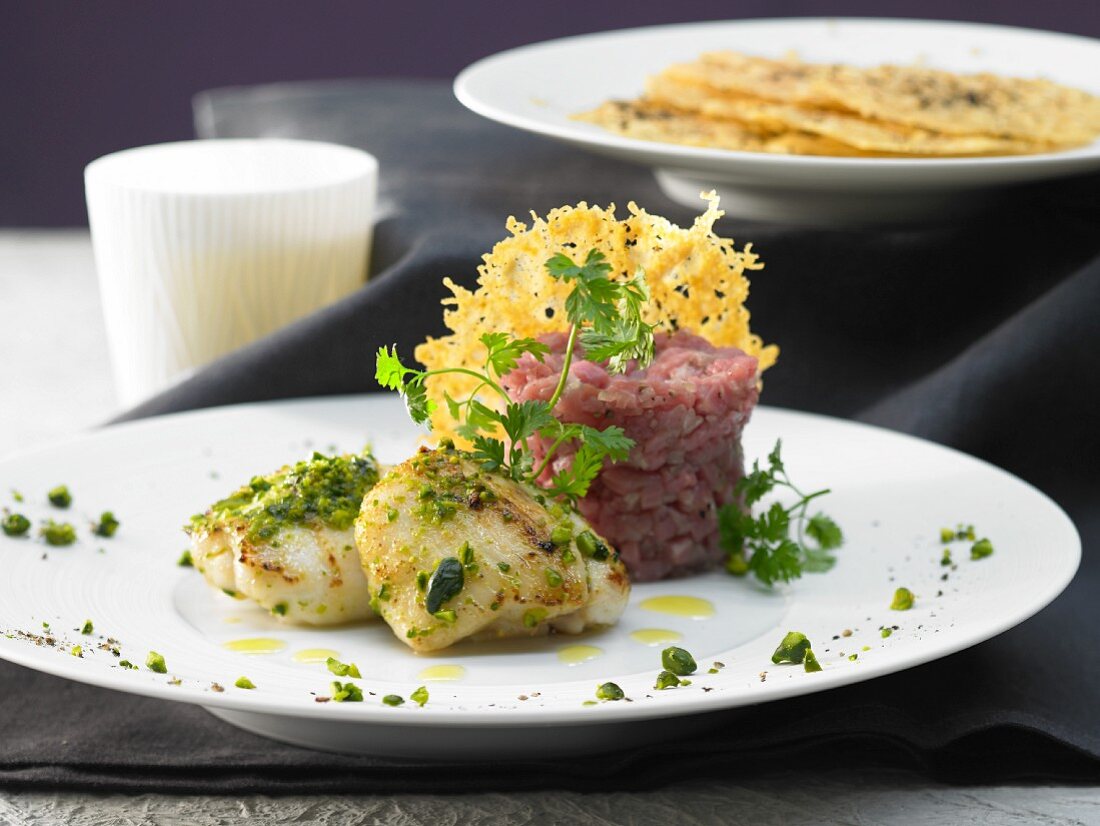 Veal tartare with monkfish and cheese and pepper pies