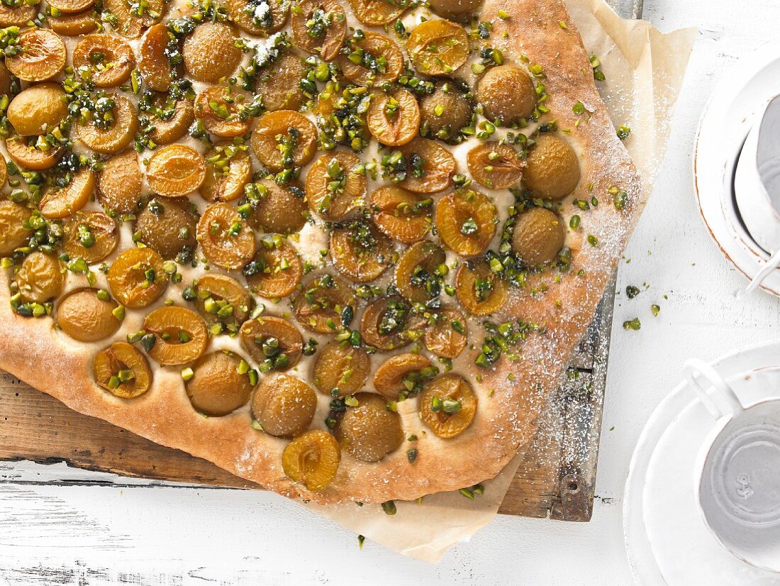 A mirabelle plum cake with chopped pistachios