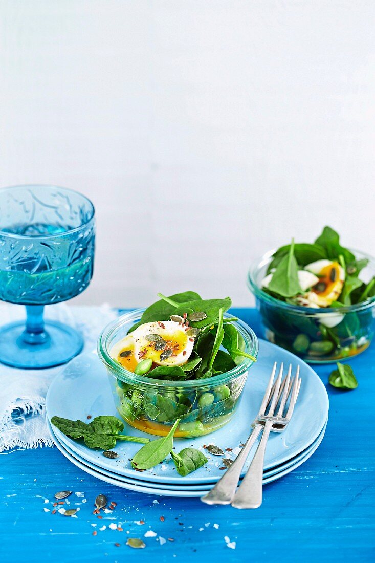 Soft boiled egg, edamame bean and spinach pot with citrus dressing