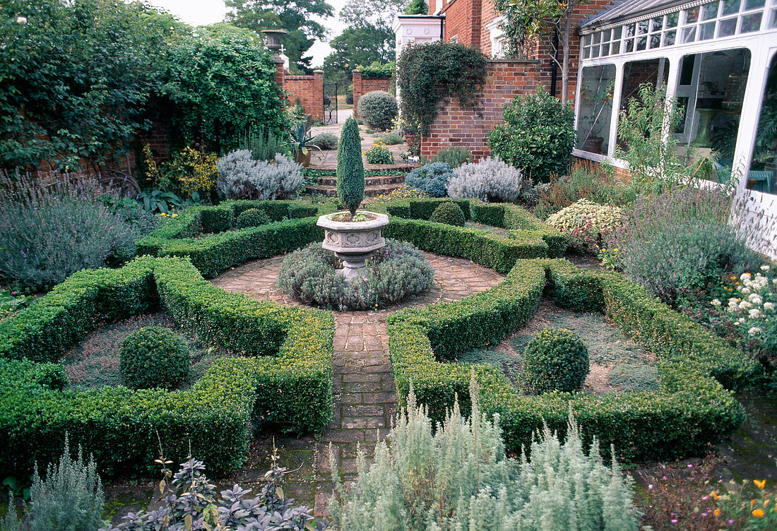 Classic Formal Patio with Boxwood Hedge