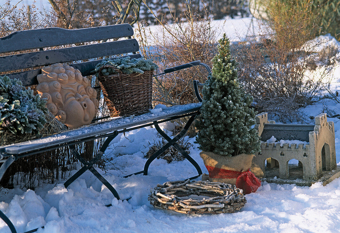 Garden bench with Picea (sugar loaf spruce), basket with Nobilis branches