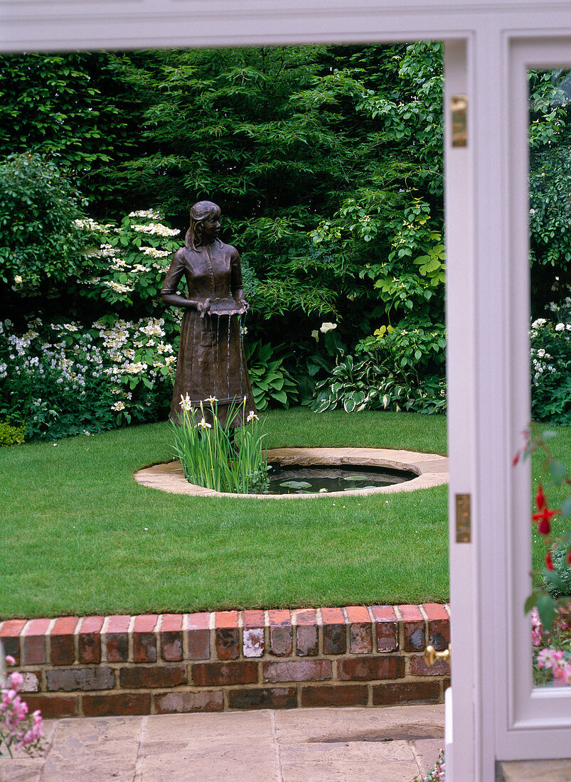 Pond with bronze figure as a water feature