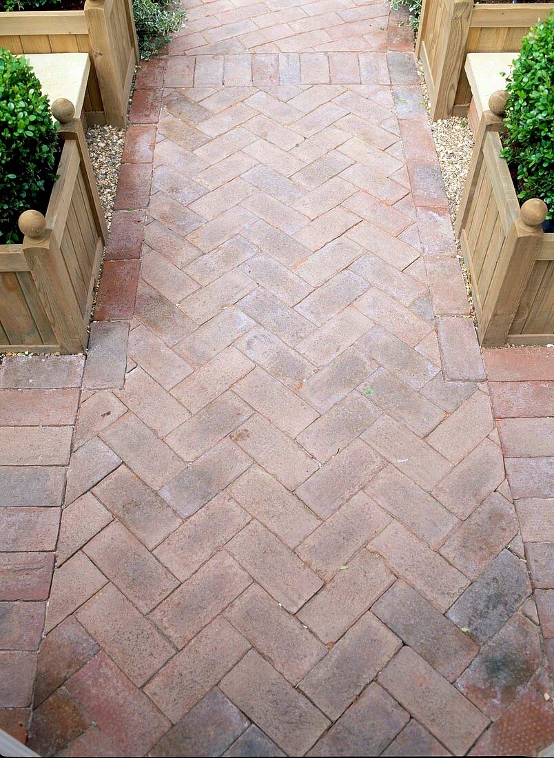 Path made of clinker bricks laid in a herringbone pattern