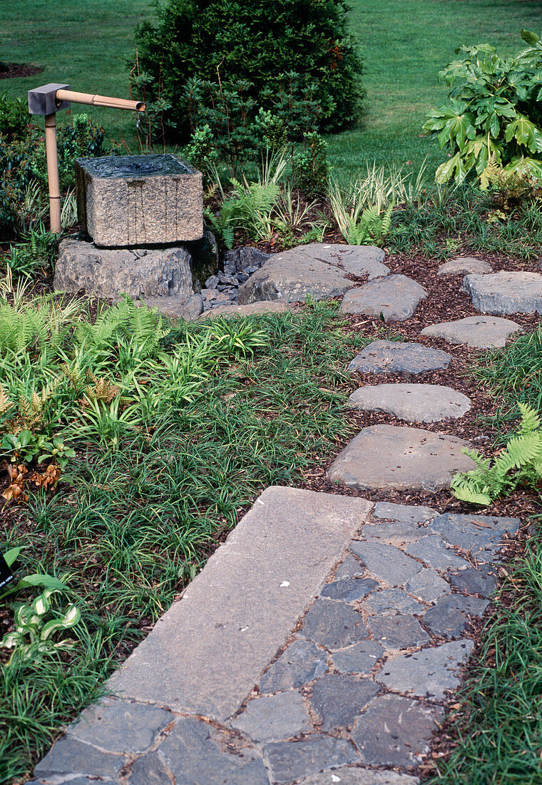 Path of natural stones with water feature