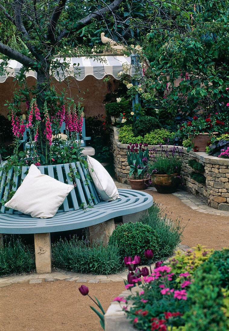 Round bench around tree, dry stone wall