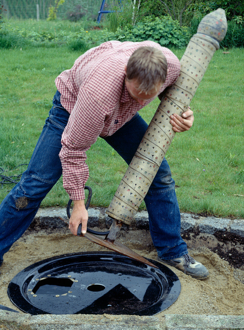 Clay column as water feature: 10